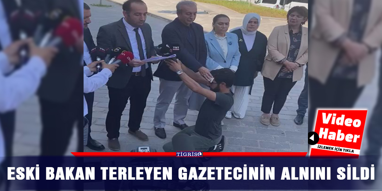 VİDEO- Eski Bakan terleyen gazetecinin alnını sildi