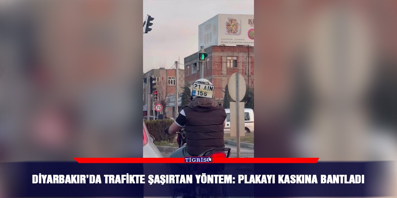 Diyarbakır’da trafikte şaşırtan yöntem: Plakayı kaskına bantladı